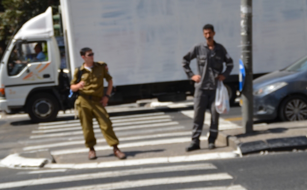 Israel soldier and Palestinian 