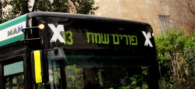 Purim sign on bus